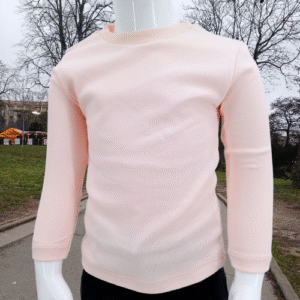 T-shirt rose à manches longues pour enfant, en 95% coton et 5% lycra, offrant confort et flexibilité. Disponible en tailles 1 à 4 ans, parfait pour un look décontracté ou en superposition.