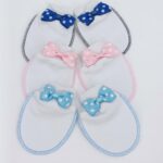 Moufles en coton doux pour bébé avec un nœud papillon à pois. Parfaites pour protéger la peau délicate des nouveau-nés