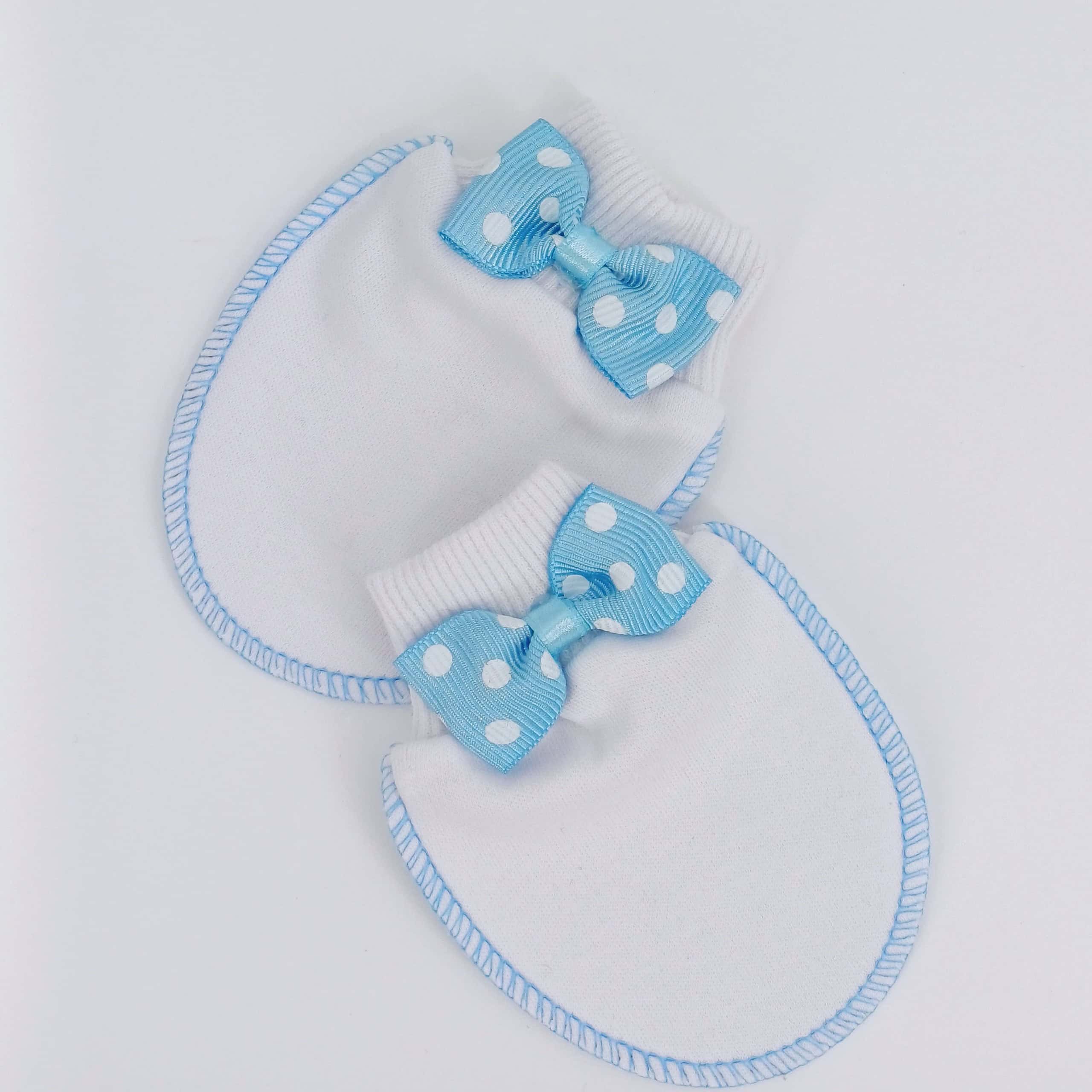 Moufles en coton doux pour bébé avec un nœud papillon à pois. Parfaites pour protéger la peau délicate des nouveau-nés