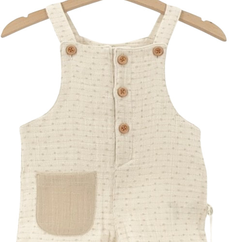 salopette bébé en coton bio écrue avec poche contrastée